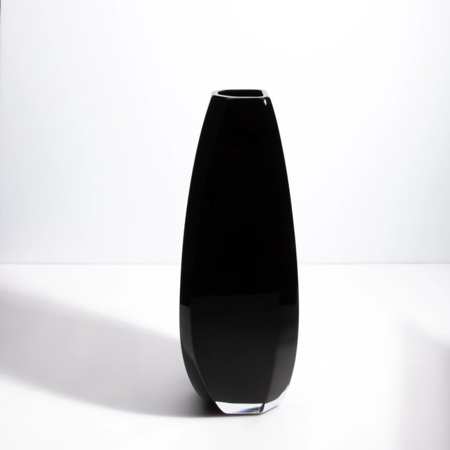 Behold the elegance of our extra tall Murano vase, a mesmerizing fusion of sleek design and masterful craftsmanship. This...
