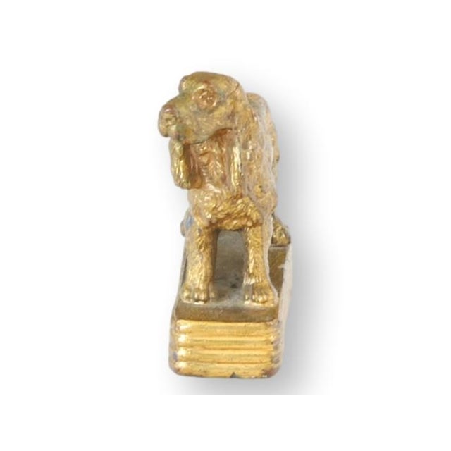 Late 19th century French desk ornament depicting a finely modeled setter dog standing alert on a rectangular plinth base....