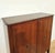Elegant bar cabinet, designed by Paolo Buffa. The wooden frame features inlaid doors and brass details, and the top is...