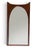 Mid-century sculpted walnut wall mirror. Arched glass set into a solid walnut frame with a concave scooped top rail and...