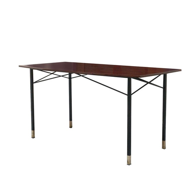 Dining table in perfect condition, featuring typically Italian design with tapered legs and a metal frame. The tabletop...