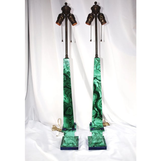 A rare find, pair of tall green malachite obelisk shaped lamps with blue Lapiz Lazuli accents. Lamps are solid...