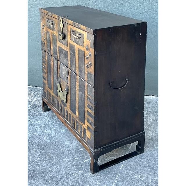 This exceptional vintage Korean Bandaji, or blanket chest, is a masterwork of rustic elegance and traditional...