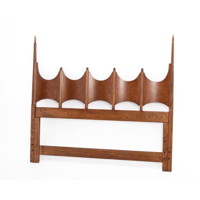 A Mid Century Thomasville queen headboard with dramatic arched or "tower" silhouettes. The headboard matches the...