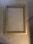 This is an elegant wood frame, lacquered in mat gold. The thick hand carved border also is lacquered in gold. The frame...