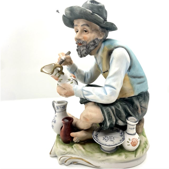 Lefton China Hand Painted #5085 is a bisque figurine of a older, bearded man painting pottery. A lovely provincial theme...