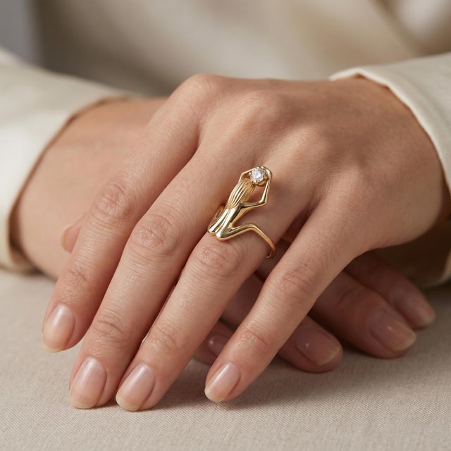 Elevate your elegance with this stunning sculpted female figure solitaire diamond ring, crafted in luxurious 18k yellow...