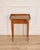 A refined Louis XVI–style side table crafted in walnut, notable for its clean neoclassical lines and honest, time-earned...