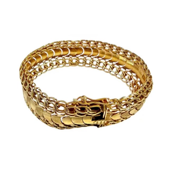 Vintage 18K Yellow Gold Italian Mesh Bracelet. Bracelet is designed with multiple rows of finely woven and polished gold...