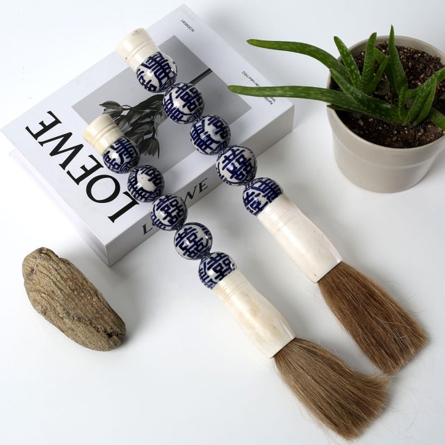 Handcrafted traditional Chinese calligraphy brushes. The handle is made with unique Chinese ceramic pieces while the brush...