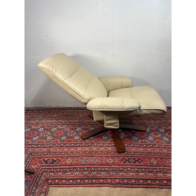 Bring everyday comfort and style into your home with this BenchMaster Newport Swivel Recliner and Ottoman Set — a perfect...