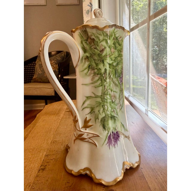 A stunning antique French porcelain chocolate pot (or tall pitcher) produced by Haviland & Co. in Limoges, France, between...