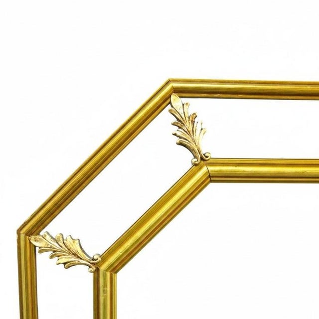 An elegant octagonal parclose mirror crafted from gilt wood, reflecting the refined aesthetics of the English Regency...