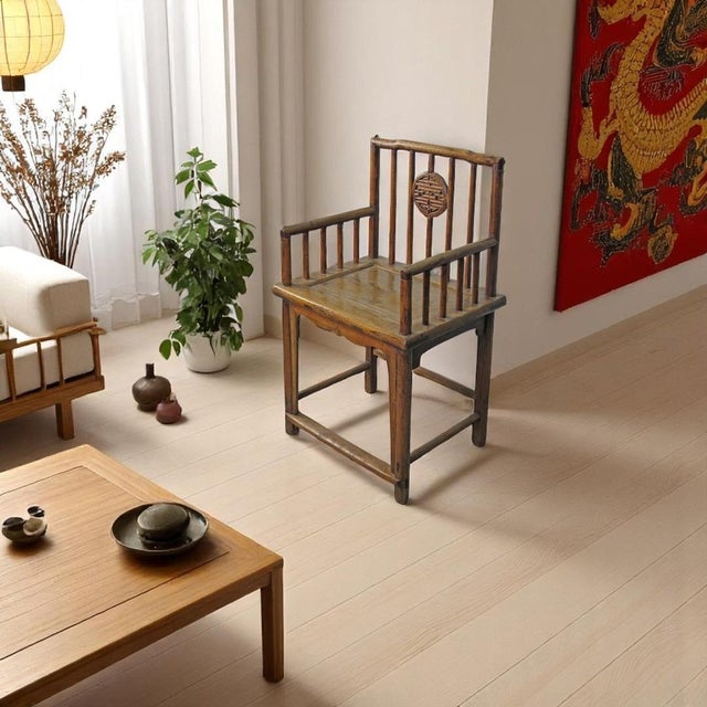 This 19th-century armchairs was constructed using traditional Chinese mortise-and-tenon joinery. The chair features a hand...