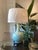 A striking vintage celadon porcelain table lamp featuring an elegant bottle-form silhouette with finely molded dragon and...
