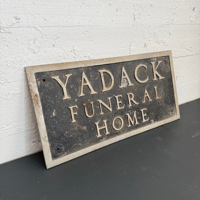 This vintage trade sign reading "Yardack Funeral Home" is most likely from the Yardack-Fox Funeral Home located in...