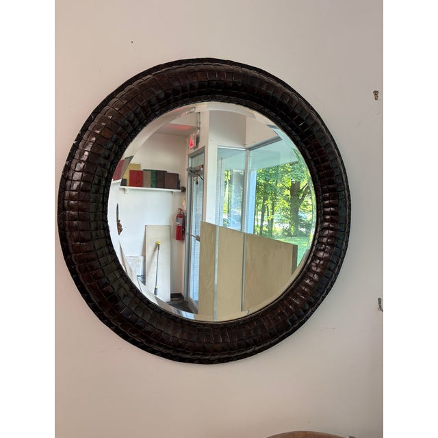40” round large over scale mirror with a beveled looking glass. The mirror is surrounded by a mosaic of polished square...