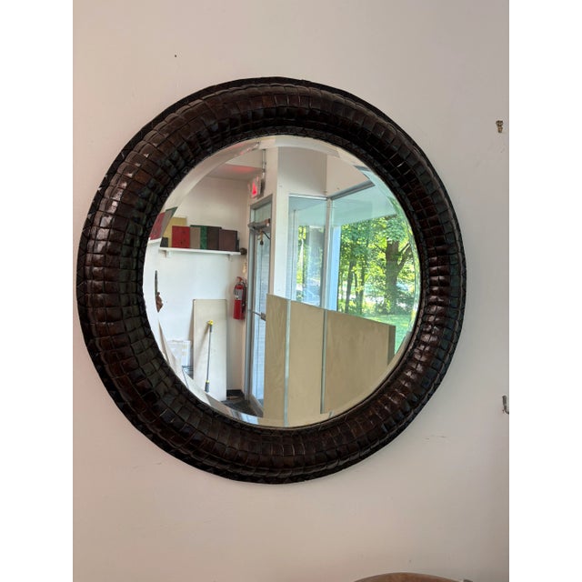 40” round large over scale mirror with a beveled looking glass. The mirror is surrounded by a mosaic of polished square...