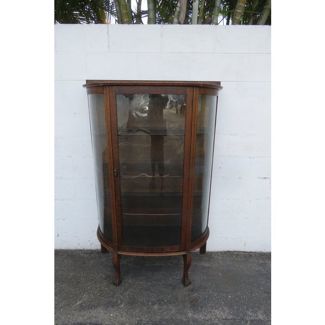This beautiful Curio Cabinet is made of wood, solid wood, solid oak, solid tiger oak, veneer, and glass. The Cabinet was...