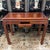 Design Plus Gallery presents a Vintage Asian Carved Hardwood Writing Desk. The rectangular top is bordered by carved...