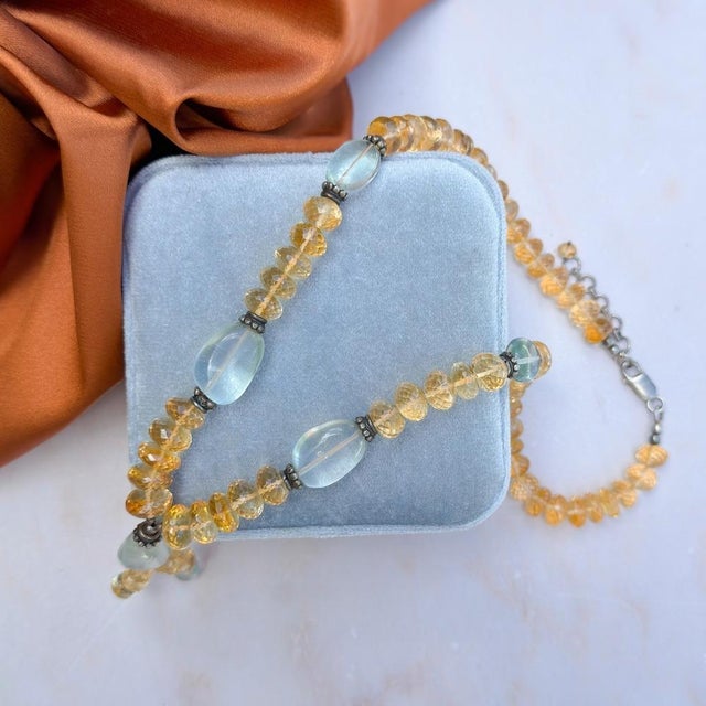 This lovely bohemian inspired necklace features hand-faceted Citrine beads and dates from the late 1990s. Condition...