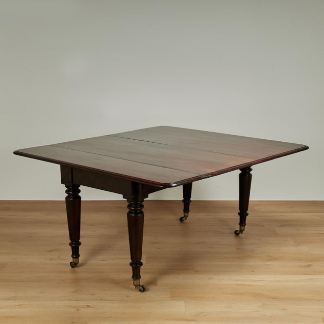 Rare and remarkable 19th century dining table with multiple uses expertly handcrafted in mahogany, having a rich dark...