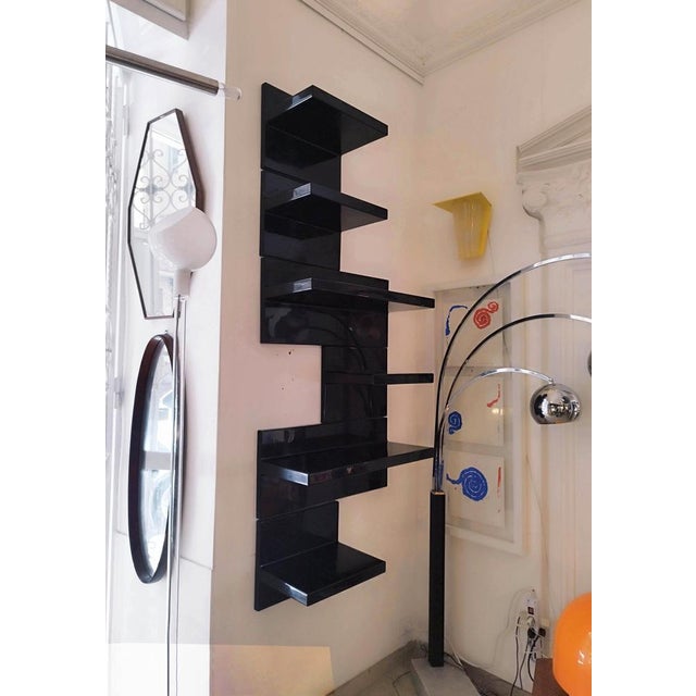 Set of six shelves with asymmetrical plastic profile in black, designed by Marcello Siard for Kartell in the 1970s, are of...