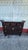 ntricately carved wooden altar cabinet is finished in a dark Rosewood stain. This piece has three top drawers and a large...