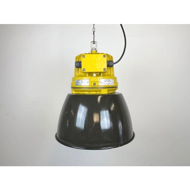 Industrial factory pendant light manufactured by elektrosvit in czech republic during the 1990s. It features a cast...