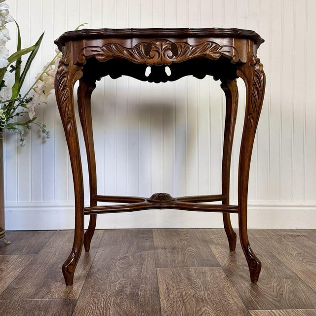 Vintage mid-century walnut accent table, likely from the 1950s–1970s. Features a French Provincial / Louis XV style, with...