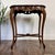 Vintage mid-century walnut accent table, likely from the 1950s–1970s. Features a French Provincial / Louis XV style, with...