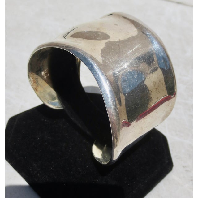 Modernist cuff in sterling. Rolling wavy contours with a slight flexability to adjust the size. Marked inside by stamp...