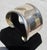 Modernist cuff in sterling. Rolling wavy contours with a slight flexability to adjust the size. Marked inside by stamp...