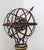 An impressive garden armillary sphere mounted upon a substantial classical-style stone pedestal The openwork iron sphere...
