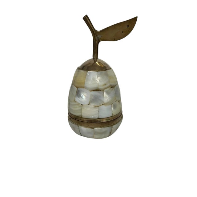 Vintage brass and mother of pearl pear figure trinket box. Measures 3” diameter x 5” h.