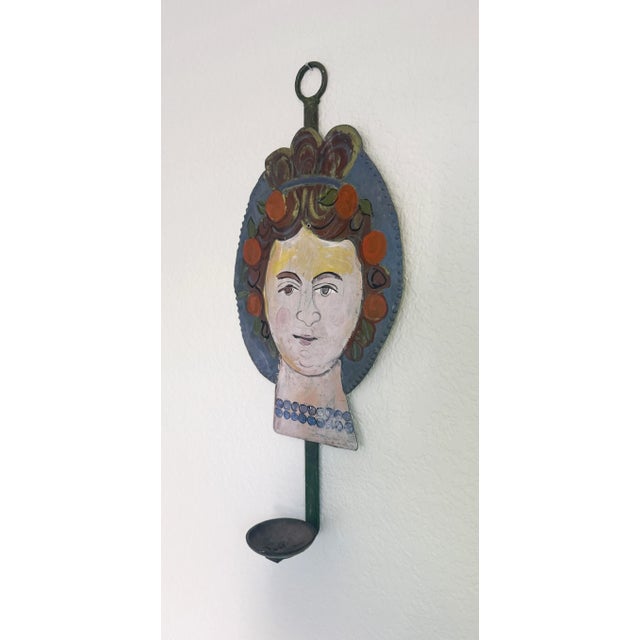Whimsical folk art-style painted candle sconce attributed to American artist Ira Yeager. A self-portrait painted in the...