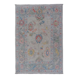 Modern All-Over Floral Oushak With Muted Background and Accent Colors For Sale