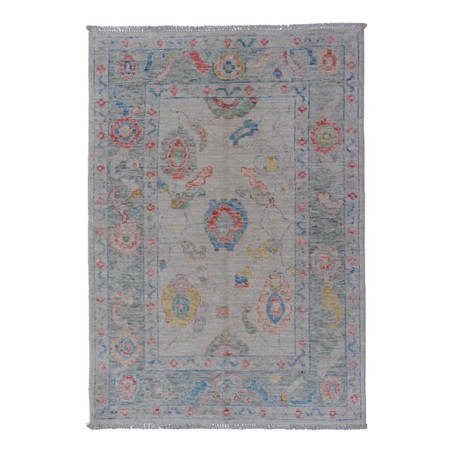 Modern All-Over Floral Oushak With Muted Background and Accent Colors For Sale
