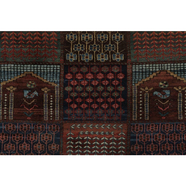 Hand-knotted in wool, this 4x5 Vintage Turkish Anatolian rug, circa 1950–1959, features a striking compartment design...