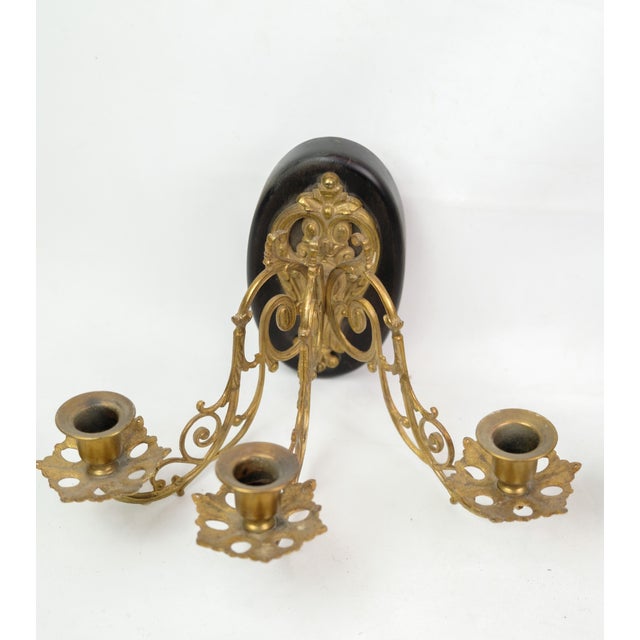 Experience an antique atmosphere with this pair of French bronze wall sconces from the 1930s. These wall sconces are more...