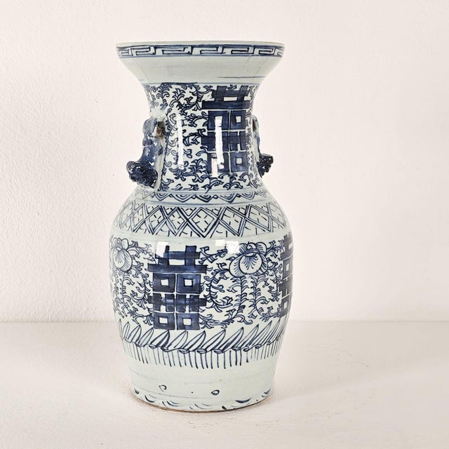 A vintage classic blue and white double happiness vase.