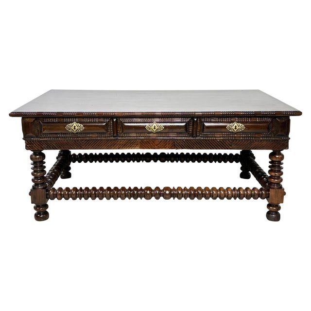 Classic Portuguese style hand carved and turned solid rosewood table, having 3 drawers and 3 false drawer on the other...