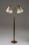 A beautifully balanced swedish floor lamp from the 1940s, executed in brass with a warm, time-softened surface. The twin...