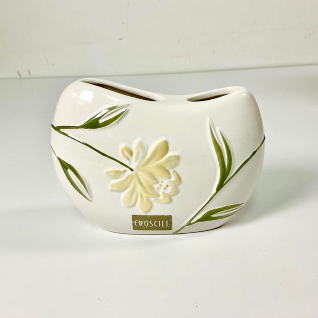 This is the lovely Penelope pattern from Croscill. It features an Art Nouveau style floral pattern with sage green stems...