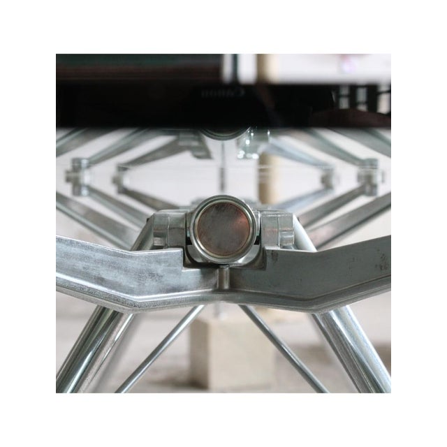 Type 'Nomos' table Date 1980-89 Style Industrial Origin Italy Materials Crystal, Chromed metal Designer Norman Foster...