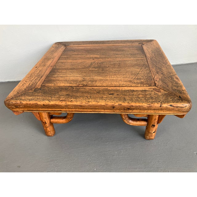 A lovely, weathered and worn rustic Asian scholar's or Kang table. This table has considerable wear and patina, but this...