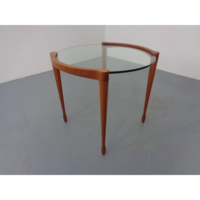 Italian side table made of glass and cherry wood by Tarcisio Colzoni for Porada from the 1990s. I have official proof of...