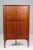 Danish cabinetmaker, corner cabinet in rosewood. with two doors where behind shelves. Under the doors two tray. Made in...