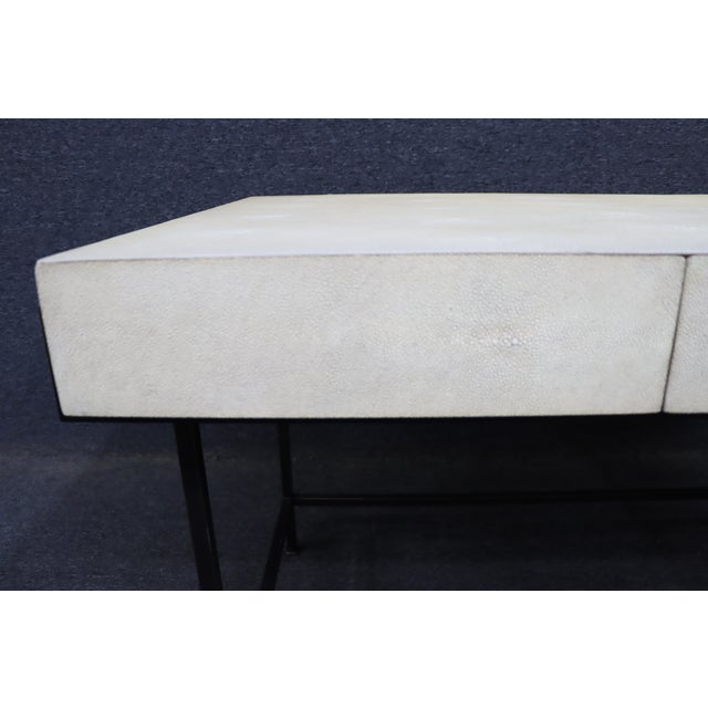 A sophisticated contemporary writing desk by Lillian August for Hickory White. The desk features a faux shagreen-clad case...