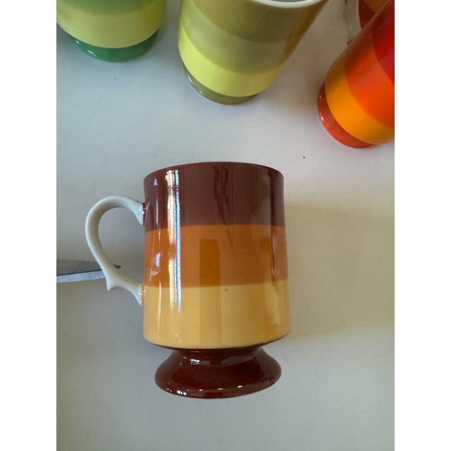 This is charming vintage 14-piece Holt Howard coffee set, featuring playful lines and vibrant colors, adds a touch of mid-...